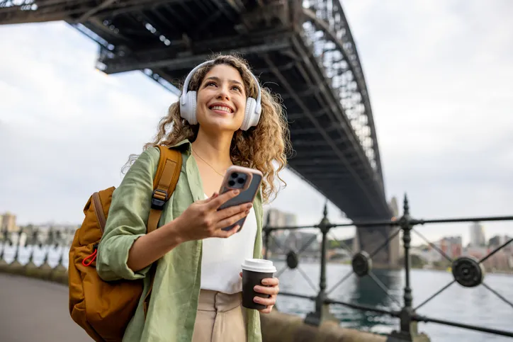 Visitor listening to a tailored audioguide while exploring a site